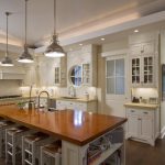 White Wooden Kitchen Cabinet With LED Lighting Above And Under