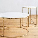 double round coffee table with gold round feet