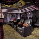purple motif curtains home theater black chairs brown carpet strips cushions black curtains lamps