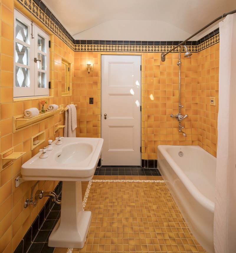 American Encaustic tiles for bathroom walls and floors in yellow free standing traditional vanity in white white bathtubs white craftsmanship door panel