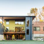 A Trendy Exterior House With Mirror Glass Windows Craftsman Exterior Materials Green And Blue Wall Finishings