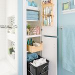 Bathroom With White Shower Bathtub Area, Blue Wall, White Wooden Cabinet