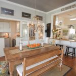 bench dining room table wood floor carpet pendants chairs farmhouse kitchen stools table cloth chandelier