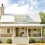 farmhouse exterior idea with white wood skirting stainless steel cable railings & white rail posts white exterior stairs hardwood entrance door and exterior glass windows
