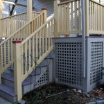 traditional porch with white cedar railing system & exterior stairs grey lattice skirting idea