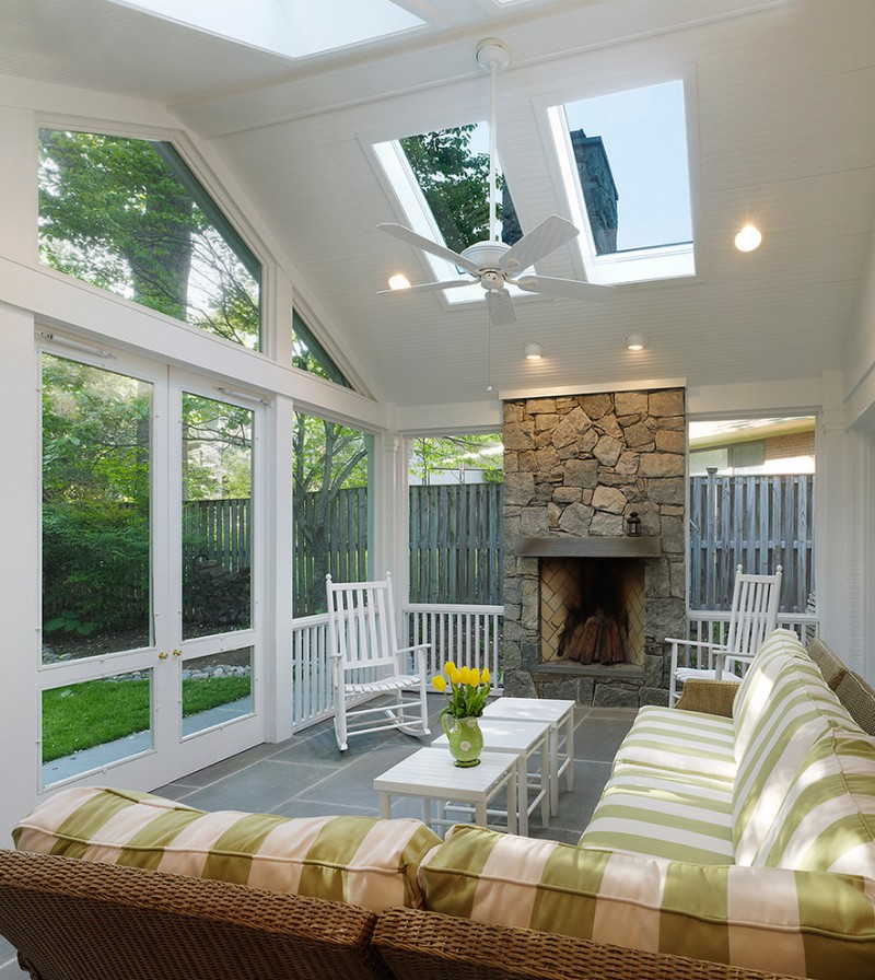 screened in patio ideas fireplace ceiling window green and white patio couch white wooden armchairs white table