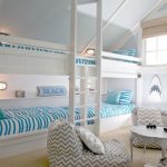 White Painted Bunk Bed Blue And White Stripped Fabrics Nautical Ornaments Cream Rug Rattan Shades White And Grey Stripped Sofas And Pillow Throws Round Coffee Table