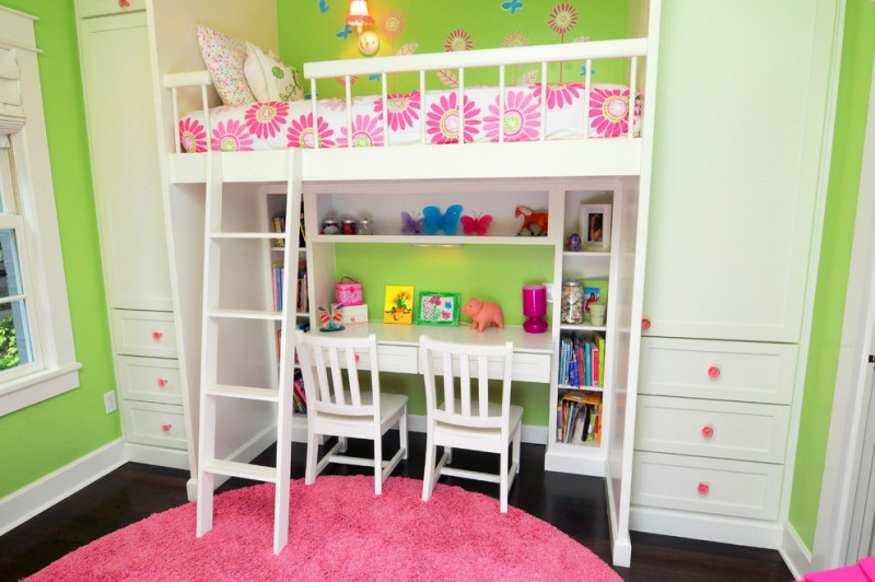 Elegant kids' room for girls with green walls and dark hardwood floors white painted loft bed and cabinets pink rug flower wallpaper