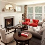 Elegant Living Room With Grey Walls Red Club Chairs White Chairs Grey Sofa Candle Hholders Coffee Table White Painted Cabinets A Fireplace Glass Windows Medium Toned Wooden Floors