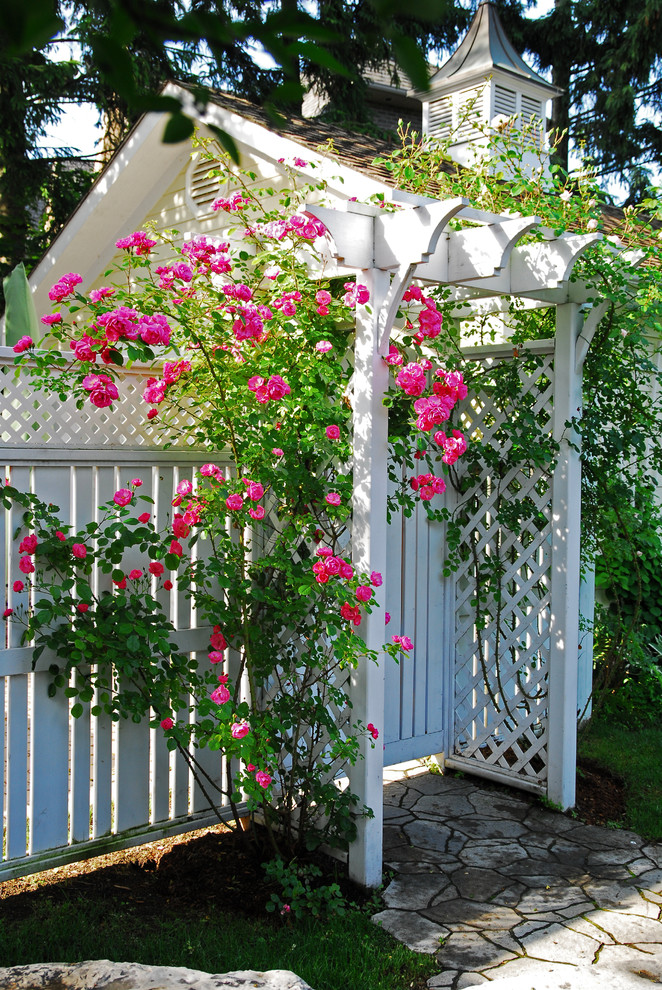 lattice fence designs stone pavers roof pink roses grass traditional design
