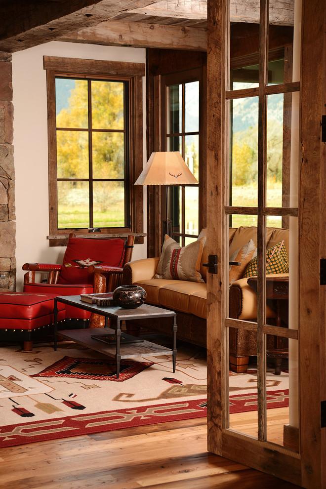 mission style living room furniture leather chair ottoman hardwood floor table sofa lamp column windows rustic design