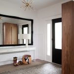 modern entryway table hardwood floors carpet chandelier radiator drawers wardrobe lamp shoes basket transitional design