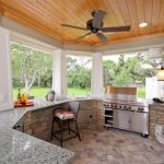 outside kitchen design stove wall tv faucet sink chair countertop ceiling fan meditarranean patio lights