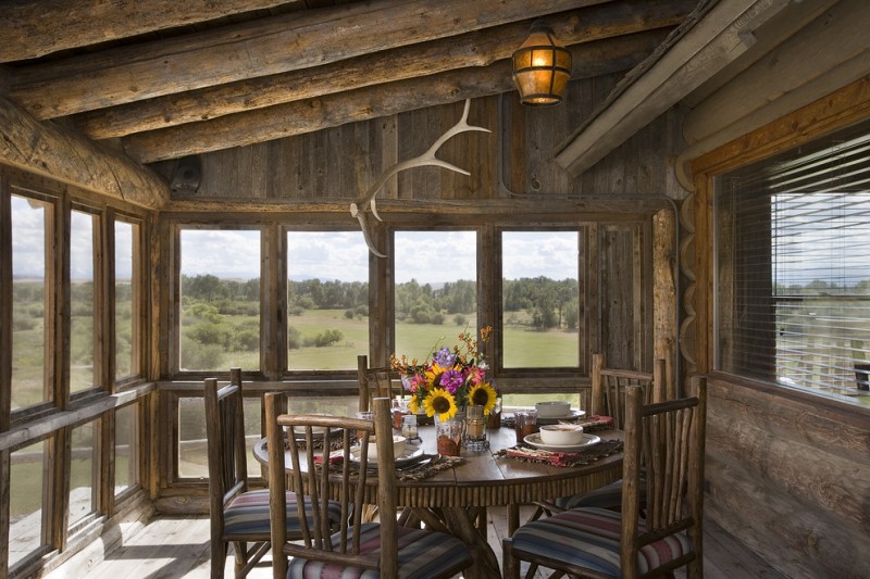 small rustic cabins table chairs flowers windows cool lamp logs wood floor beautiful porch