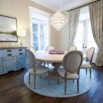 Shabby Chic Dining Nook With Soft Toned French Dining Chairs Round Top Wood Dining Table Round Area Rug In White Dark Hardwood Floors Wood Top Hall Console Crystal Chandelier