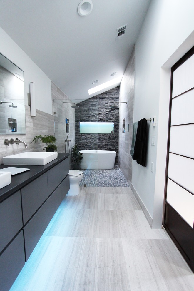 walk in shower designs grey and white bathroom stone wall white tub vaulting ceiling dak grey vanity sinks mirrors towel holder