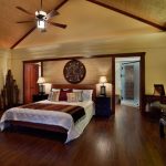 Ceiling Styles Bedroom Bench Ceiling Fan Cove Lighting Crown Molding Dark Wood Trim Sloped Ceiling Bed Nighstands