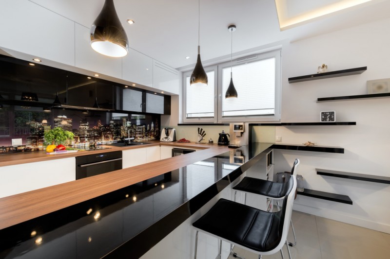 modern chic kitchen black and white cabinet peninsular kitchen wall mounted shelves windows black pendants and barstools
