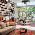Bookcase With Ladder And Rail Red Patterned Area Rugs Pendant Lights Noguchi Coffee Table Beige Sofa Office Chair And Desk Glass Windows