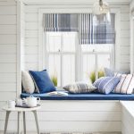 Built In Reading Nook With White Wooden Wall, White Wooden Beams, White Wooden Floor, White Blue Striped Rug, White Wooden Stool