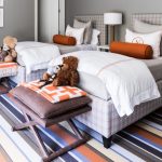 Kids Bedroom With Grey Wall, Striped Flooring, Two Plaid Beddings, Brown Stool