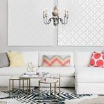 Nesting Cocktail Table White Couch Colorful Throw Pillows Cowhide Rug White Side Table White Table Lamp Chair Hrey Shad Rug Chandelier