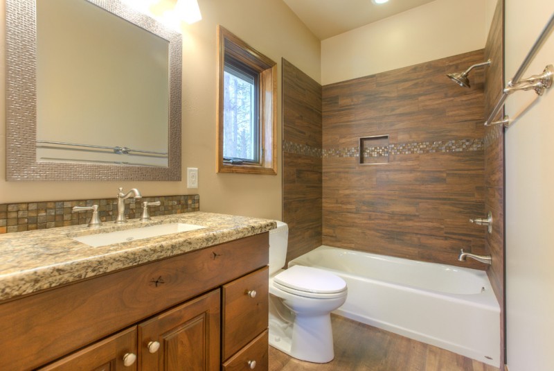 bathtub cartridge wooden wall tile built in tub shower head wooden vanity sink granite countertop wall mirror window