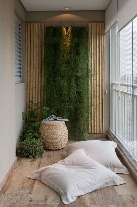 balcony with wooden floor, windows, white wall, bamboo, plants, ottoman