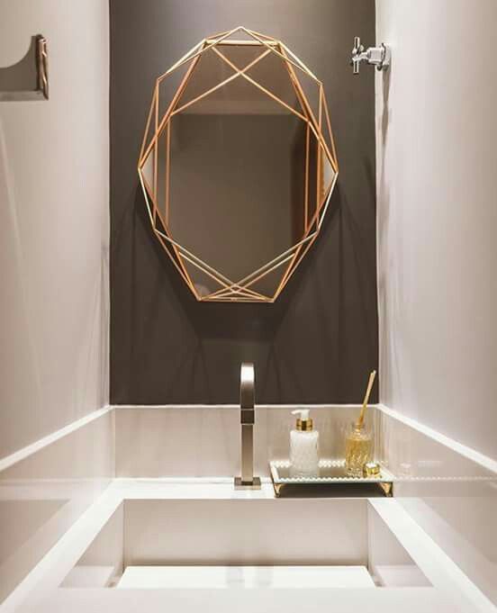 bathroom mirror with golden lines frame from the outlines to the mirror itself