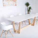 Dining Area, White Flooring, White Wall, White Midcentury Modern Chairs, Wooden Legged Table With White Top, Plants