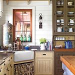 Kitchen With Brown Wooden Floor, White Wooden Wall, Brown Wooden Cabinet, Larder, White Ceramic Sink, Dark Kitchen Top