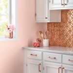 Kitchen With White Cabinet, Pink Painted Wall, White Sounter Top, Rose Gold Backsplash