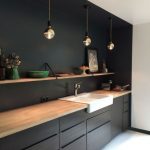 Kitchen With White Floor, Black Cabinet Under Wooden Counter Top, Black Wall And Some Of The Ceiling, Open Shelves