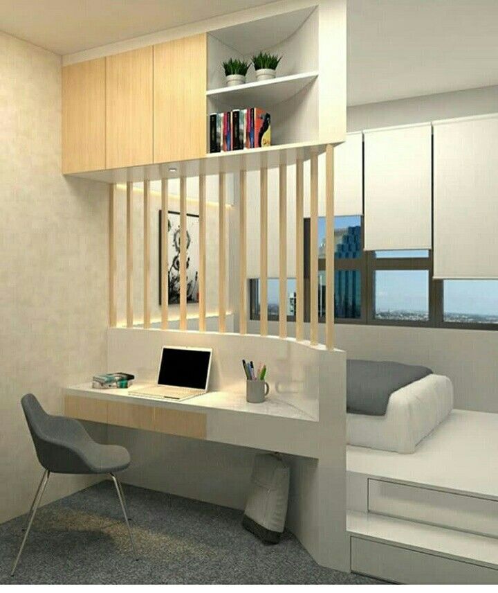 minimalist bedroom with white floor platform, grey rug floor, white table, fence, shelves above the table, window