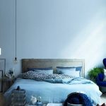 Bedroom, Blue Wall, Wooden Floor, Blue Bedding, Wooden Bed Platform, Low Coffee Table,