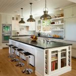 Kitchen Island Dimensions With Seating Wooden Island Industrial Pendant Lamps White Cabinets Windows Black Countertops Shelves Stovetop White Backsplash