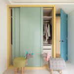 Built In Cupboard With Green Sliding Door, Yellow Frame, Drawers And Shelves Inside