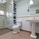 Shower Pan Tiles Mosaic Wall Tiles Built In Shelves Toilet Pedestal Sink Wall Mirror Wall Sconces Glass Shower Door Towel Holder Window
