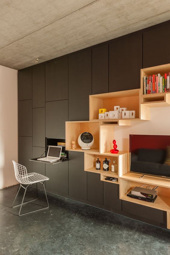 wall partition with black cabinet, brown wooden shelves on C chapes, folding, black floor
