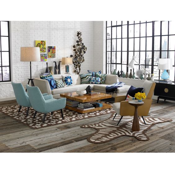 04 living room, wooden floor, brown rug, white open brick wall, white corner sofa, blue chairs, wooden coffee table, glass window, floor lamp