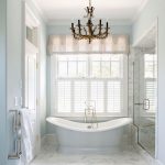Bathroom, White Marble Floor, White Wall, White Window, Chandelier, Glass Partition On Shower Area