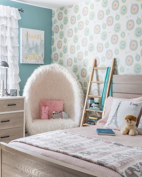 kids bedroom, patterned wallpaper, green wall, white furrle curtain, white fur chair, wooden bed platform, wooden cabinet