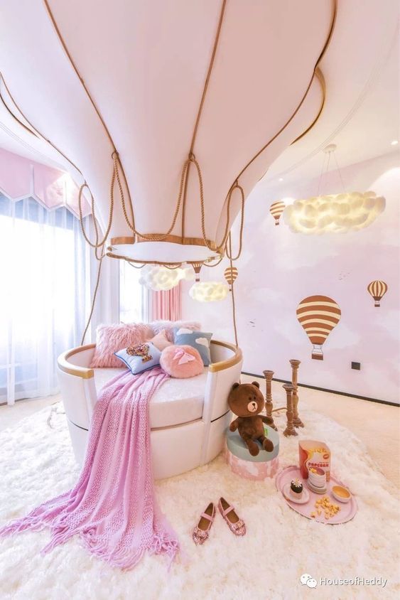 kids bedroom, white floor, pink wall with white cloud, white round bed with air balloon
