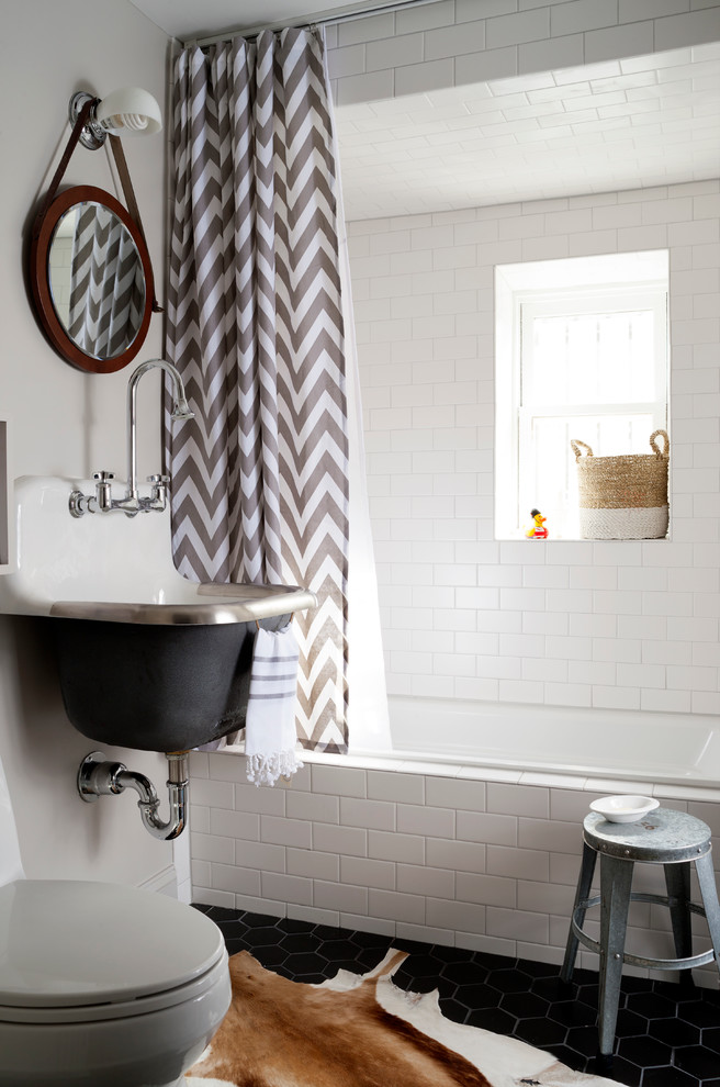 nice shower curtains chevron curtain black hexagonal floor tile white subway tiles glass window built in tub wall mounted sink faucet round wall mirror toilet cowhide rug