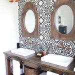 Vanity With Patterned Tiles On The Wall, Wooden Table, Mirror With Wooden Frame, Copper Pendant, Brown Floor Tiles