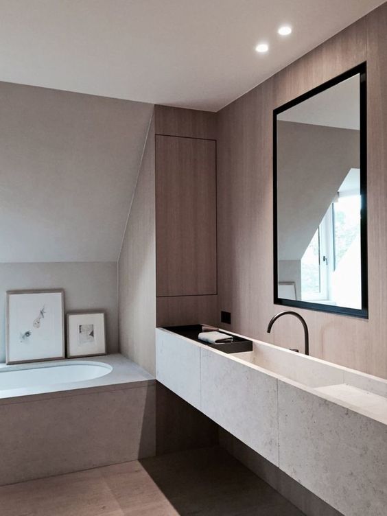 bathroom, grey bath tub, grey floating floating, black faucet, brown wall, round tub