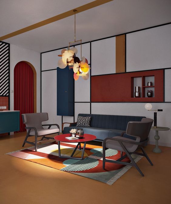 white wall, blue yellow red block with shelves, brown floor, blue sofa, grey chairs, red round table, pendant, blue cabinet