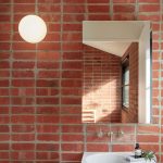 Red Open Brick Wall, White Square Sink, Mirror, White Sloping Ceiling