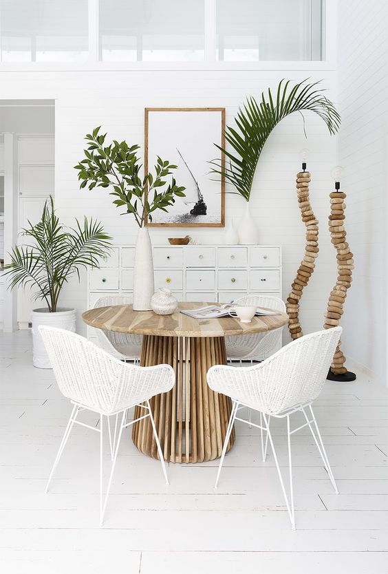 dining set, white wooden floor, white wall, round wooden table, white rattan chairs, white cabinet