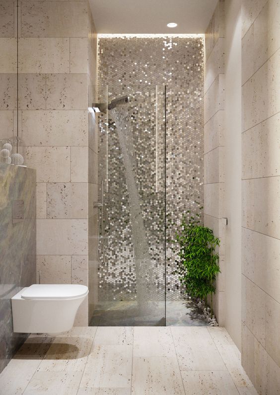 bathroom, cream floor, cream wall tiles, white floating toilet, glitter accent wall, shower, grey marble wall